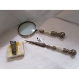 Magnifying glass, letter opener and paperweight