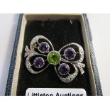 Fine gold diamond amethyst & peridot bow suffragette brooch