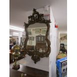 Early and ornate gilt framed wall mirror