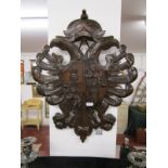 Carved treen coat-of-arms plaque