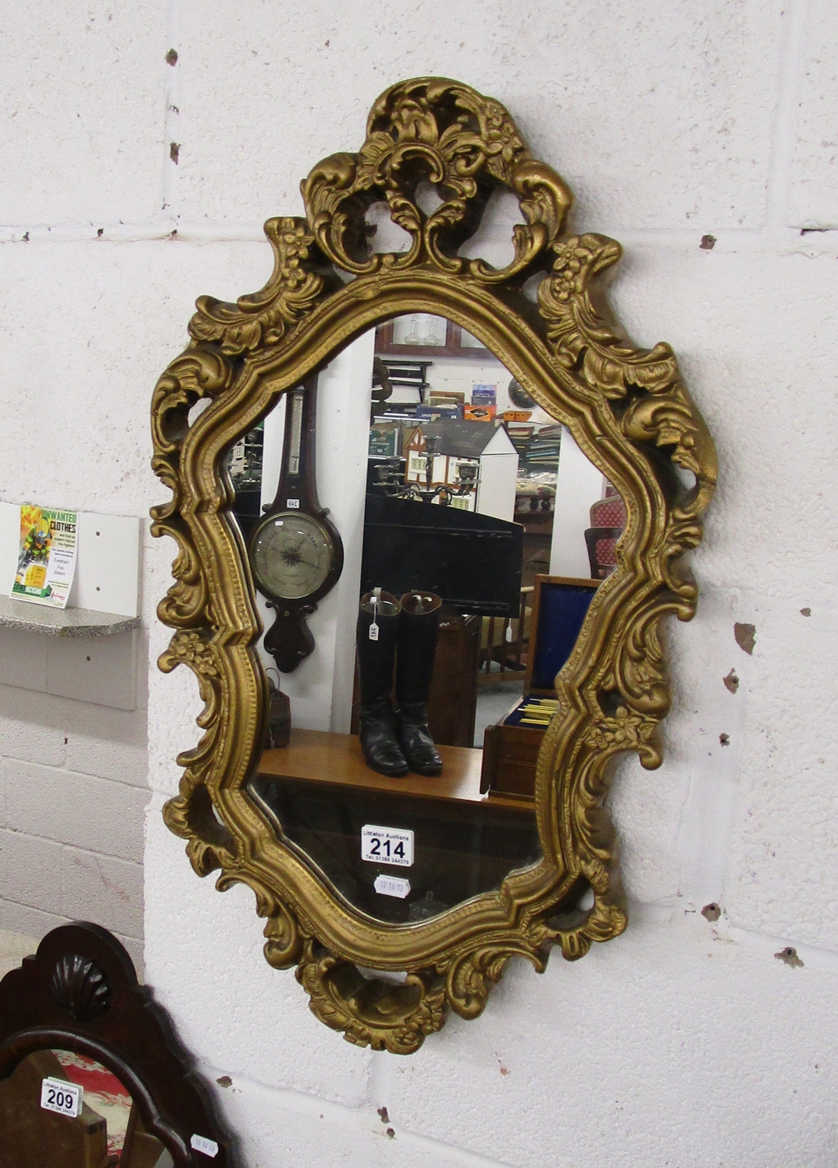 Ornate gilt framed wall mirror