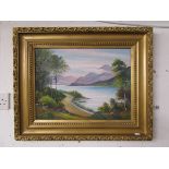 Oil on board in gilt frame - Lake scene