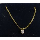 Diamond solitaire pendant in 18ct setting on fine 18ct chain