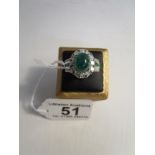 Fine platinum set emerald & diamond set ring