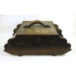 A 19th century oak coal scuttle, the body made by using earlier planks of oak,