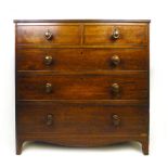 An early 19th century mahogany chest of two over three graduated drawers, the reeded,