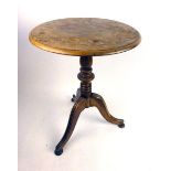 An early 19th century mahogany tilt top tripod table,