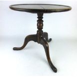 An 18th century oak dish top tripod table with turned column and three splay legs, h.