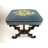 A William IV rosewood X framed stool upholstered in blue floral embroidery,