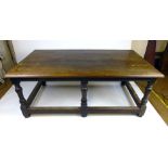 A mid 19th century oak refectory table, the moulded top over six turned legs joined by stretchers.