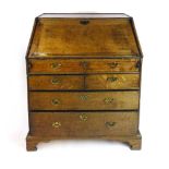 A second quarter of the 18th century oak bureau,