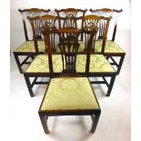A set of six late 18th century mahogany dining chairs the carved top rail over a pierced wheatsheaf