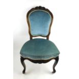 A Victorian walnut bedroom chair upholstered in a a blue draylon fabric,