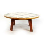 A 1960's David Joel Ltd. circular coffee table, the tile top in a pine and plastic surround, d.