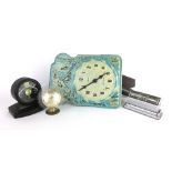 A group of timepieces and desk calendars including a Robert Welch Westclox bakelite alarm clock