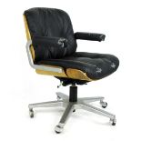 A Giroflex bentwood and black button upholstered office chair on a five star swivel base