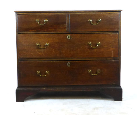 A mid 18th century oak chest of two short over two long drawers on bracket feet. h. 90 cm, w.