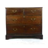 A mid 18th century oak chest of two short over two long drawers on bracket feet. h. 90 cm, w.