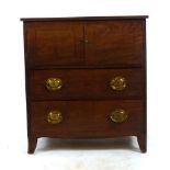 A Georgian mahogany pot cupboard with two cupboard doors over two drawers. h. 69 cm, w. 63 cm. d.