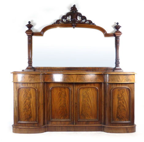 A Victorian mahogany mirror backed sideboard with shield crest to top of mirror frame and fluted