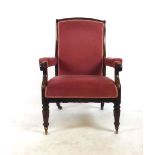 A 19th century rosewood open arm chair upholstered in pink cut fabric,