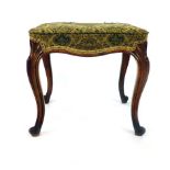 A Victorian walnut stool on carved cabriole legs with shell design to top. h. 44 cm, w. 48 cm, d.