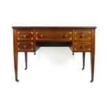 A late 19th century mahogany, boxwood line inlaid and marquetry writing table,