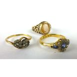 A 22ct yellow gold ring set centrally with a diamond and pale sapphire cluster,