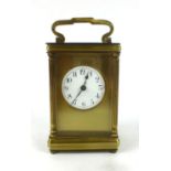 A brass cased five glass carriage clock, the enamelled face with Arabic numerals. h. 14 cm, w. 7.