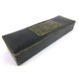 A Moroccan black leather glove box,