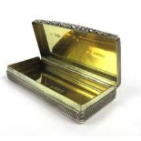 A George IV silver, parcel gilt and engine turned snuff box of rectangular form, maker WE,