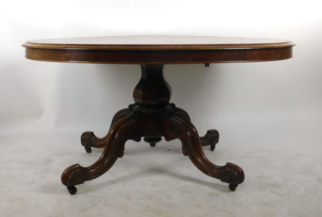 A Victorian rosewood oval breakfast table,