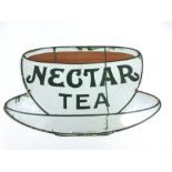 An enamel advertising sign for Nectar tea in the form of tea cup and saucer