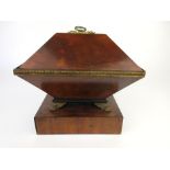 A 19th century and later mahogany tea caddy of unusual form, with lion mask handles,