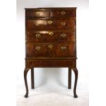 An early 18th century and later walnut and crossbanded chest on later stand,