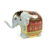 A cased Royal Crown Derby paperweight modelled as 'The Mulberry Hall Baby Elephant' by Hugh Gibson,