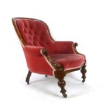 A Victorian mahogany salon chair upholstered in a cut pink button backed fabric,