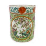 A Chinese Qing Period jar and cover decorated in the famille rose palette with four panels, h.