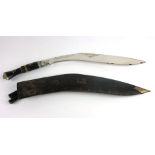 A large mid 20th century Kukri knife, with an inlaid horn handle with lion pommel,