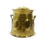 A late 19th century hammered brass Arts & Crafts coal bucket. h. 42 cm, dia 39 cm.