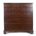 A late 18th century oak chest of two over four long graduated drawers with original gilt brass swan