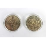 Two Chinese coins having dragon and Tai Chi symbols to one side the other having nine character