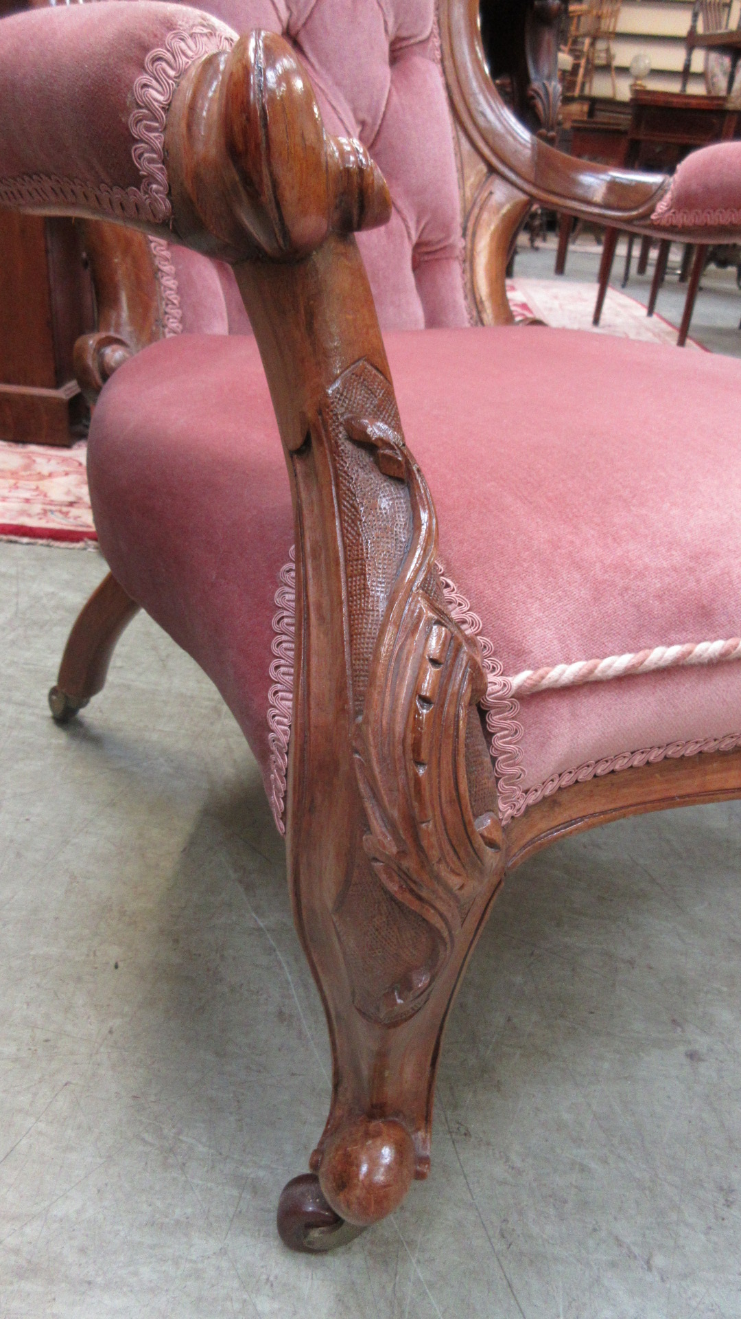A Victorian walnut salon chair upholstered in a cut pink button backed fabric on carved cabriole - Image 3 of 5