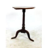 An 18th century oak tripod table, the octagonal top on turned column. h.