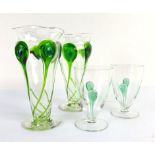 A pair of 20th century clear glass vases of flowerhead form relief decorated with green glass