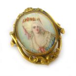 A 19th century yellow metal brooch of oval form centrally set with a miniature portrait on ivory