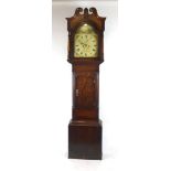 A 19th century oak and mahogany crossbanded longcase clock the swan neck pediment above a painted