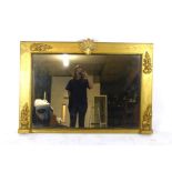 A Regency gilt framed over mantle mirror with applied flame design moulding and shell to top. h.