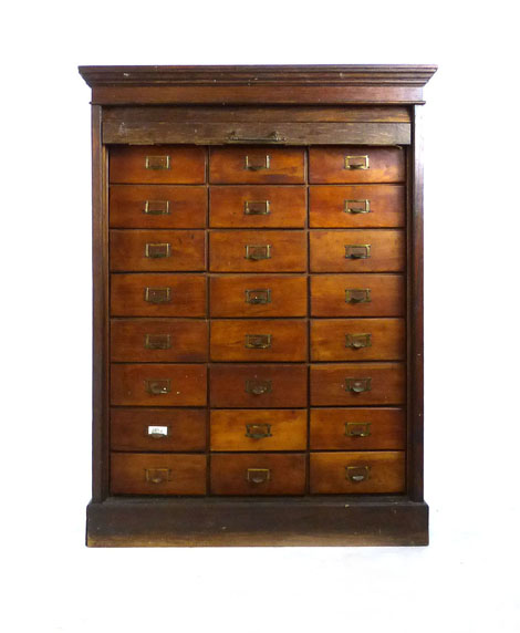 An Edwardian oak tambour fronted bank of twenty four drawers on plinth base. h. 116 cm, w. 86 cm, d.