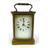 A French brass cased five glass carriage clock the enamelled face with Roman numerals signed